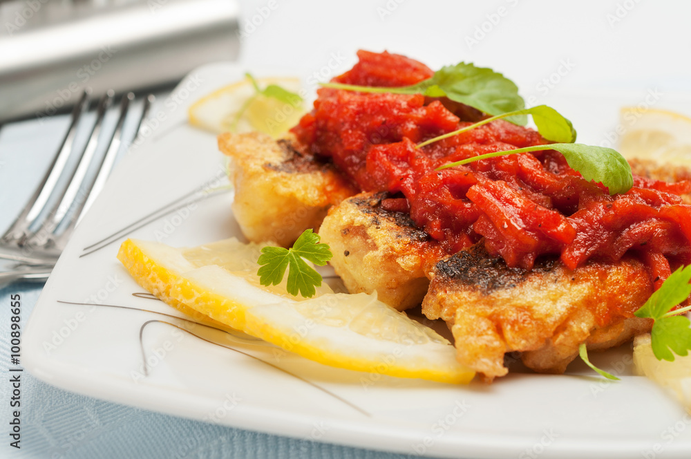 Pieces of fried fish with vegetable marinade. Pieces of fried fish with vegetable marinade.