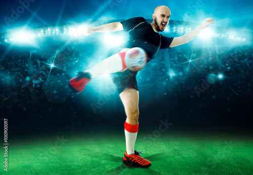 Horizontal portrait of soccer player shoots the ball in the game