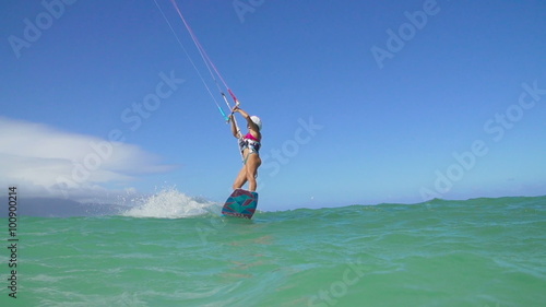 Woman Kite Surfing In Santa Claus Hat 