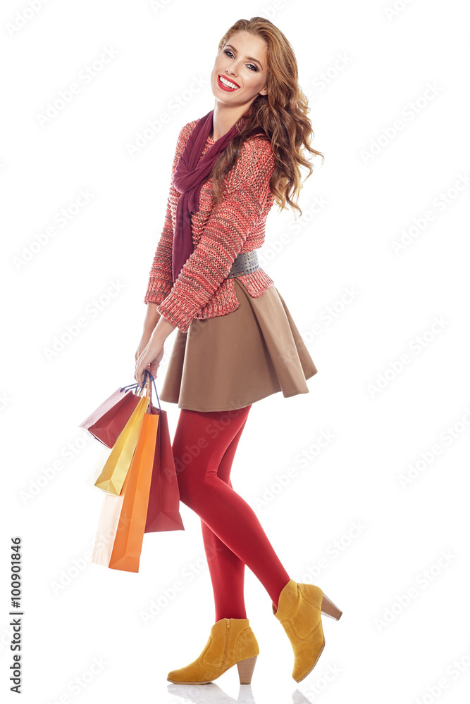 young happy smiling woman with shopping bags, isolated over whit young happy smiling woman with shopping bags, isolated over whit