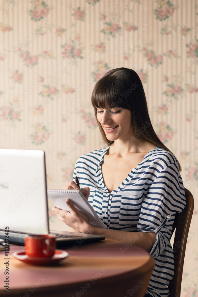 Smiling businesswoman working at her office at home. Smiling businesswoman working at her office at home.