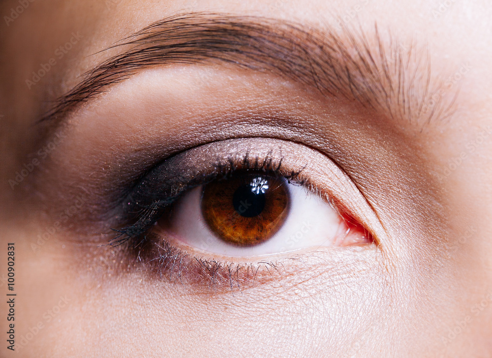 Fototapeta premium Beautiful woman's brown eye close up
