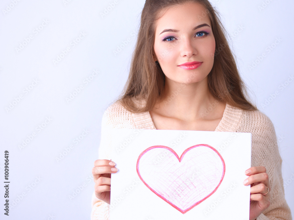 Portrait of young beautiful woman showing gift card. Valentines Day Portrait of young beautiful woman showing gift card. Valentines Day