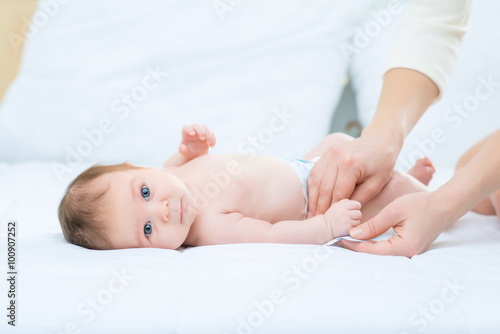 Cute infant lying in bed 