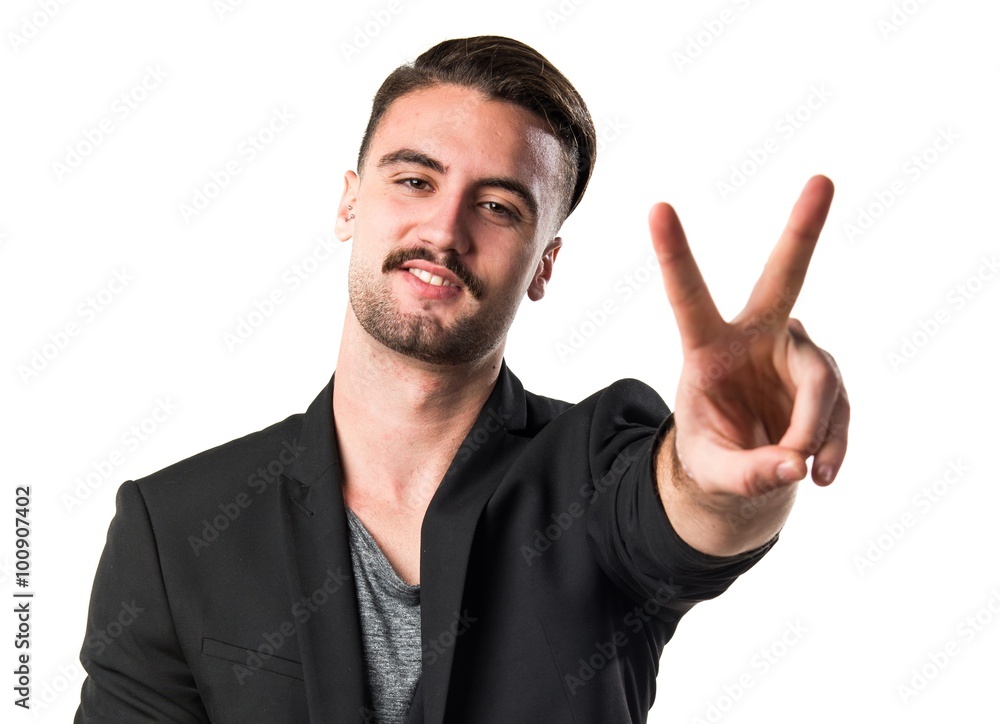 Handsome man doing victory gesture Handsome man doing victory gesture