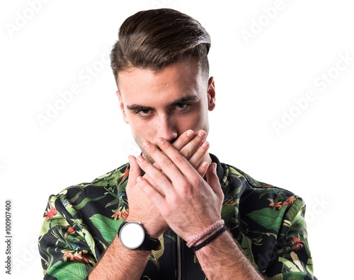 Cuadro en lienzo Handsome man covering his mouth