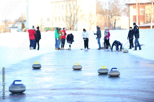 People playing in curling Fototapeta