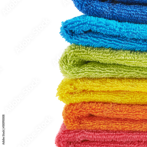 Pile of rainbow colored towels isolated
