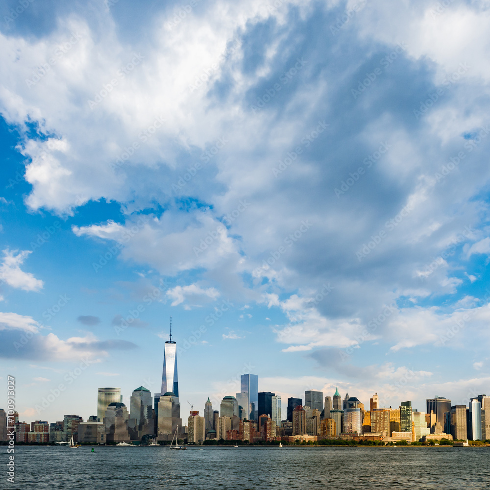 New York City cityscape during day - with blue sky and white clouds