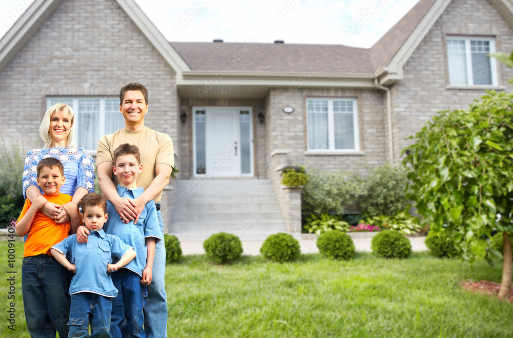 Happy family near new house. Happy family near new house.