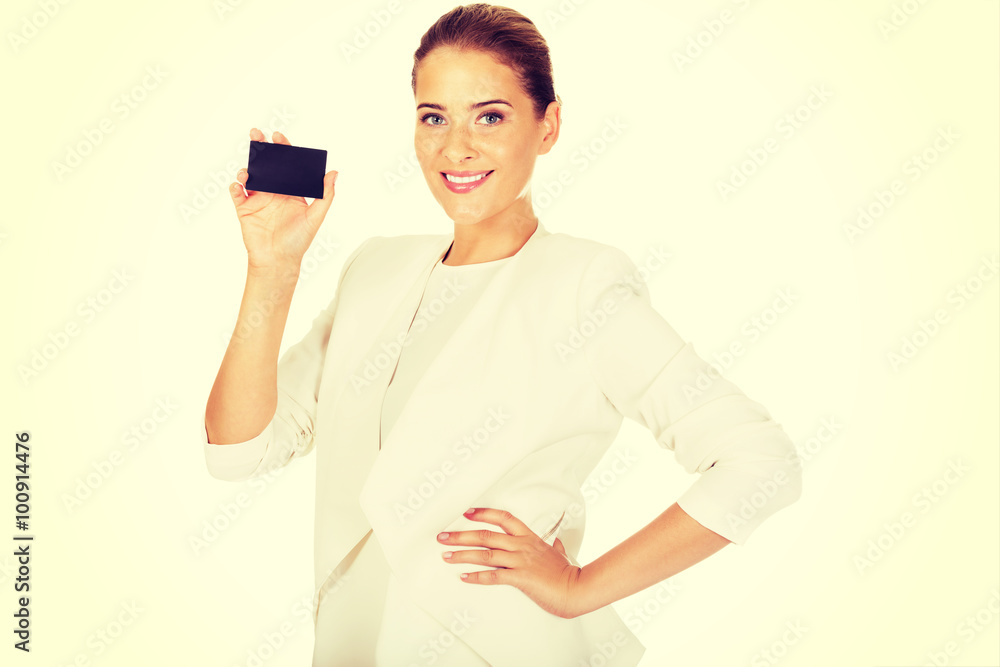 Young businesswoman shows business card
