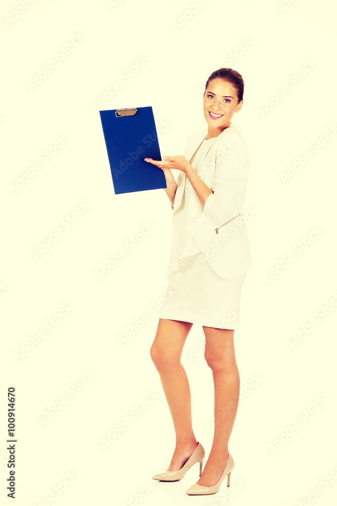 Young businesswoman show empty clipboard Young businesswoman show empty clipboard