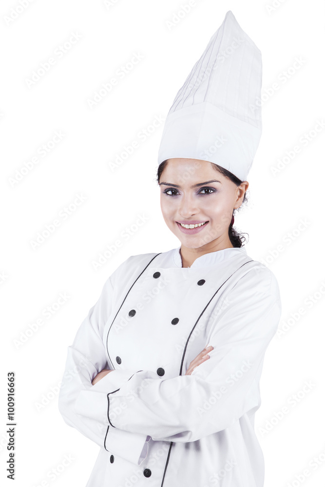 Indian woman chef standing in studio Indian woman chef standing in studio