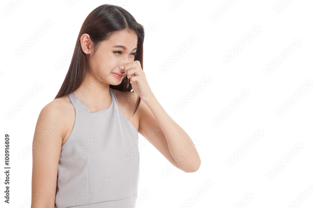 Young Asian woman holding her nose because of a bad smell Young Asian woman holding her nose because of a bad smell