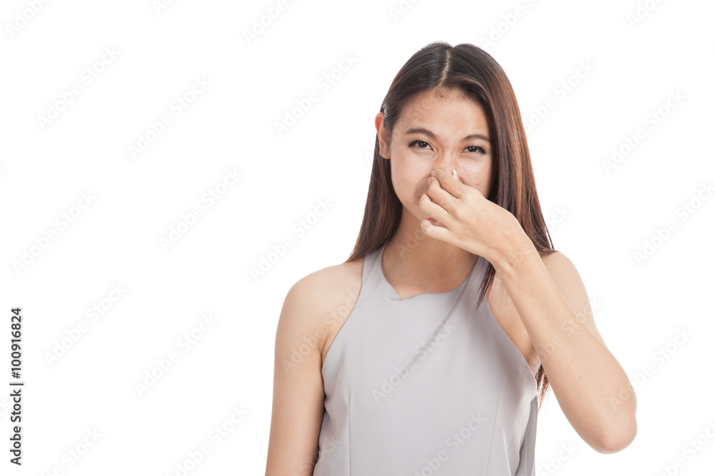 Young Asian woman  holding her nose because of a bad smell