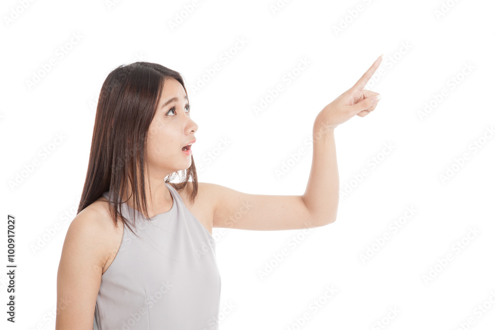 Beautiful young Asian woman shocked and point up Beautiful young Asian woman shocked and point up