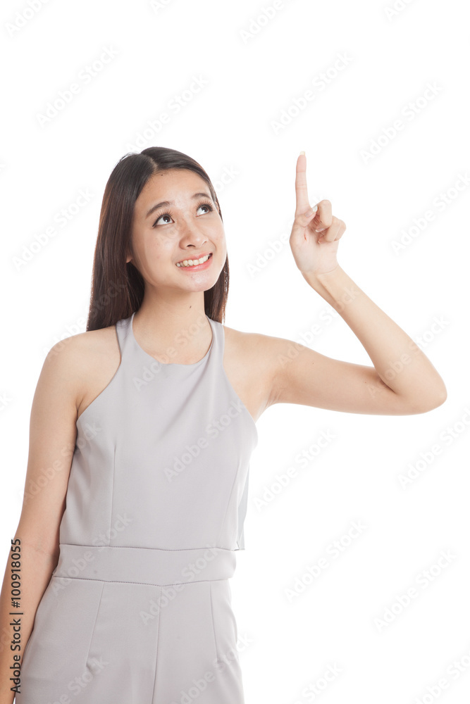 Beautiful young Asian woman point up to blank space Beautiful young Asian woman point up to blank space