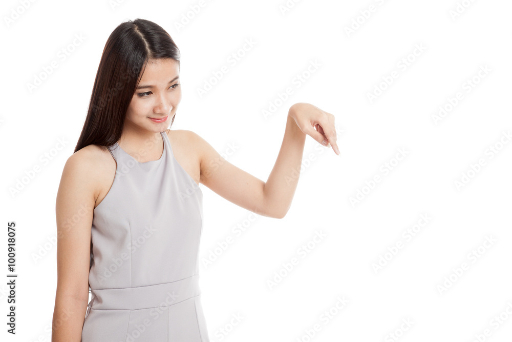 Beautiful young Asian woman point down to blank space Beautiful young Asian woman point down to blank space