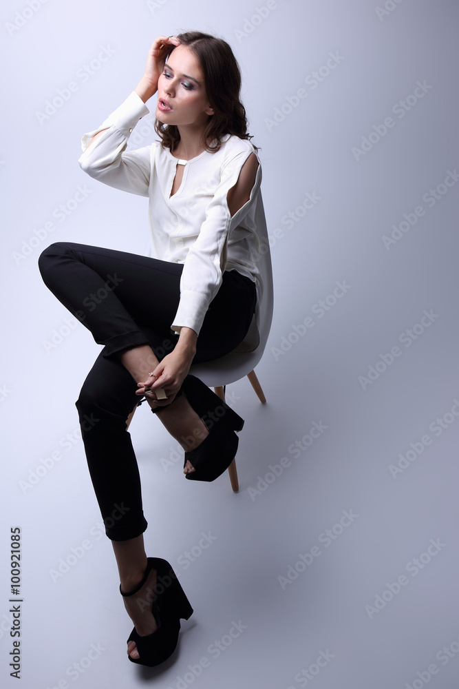 high fashion portrait of young elegant woman. Studio shot high fashion portrait of young elegant woman. Studio shot