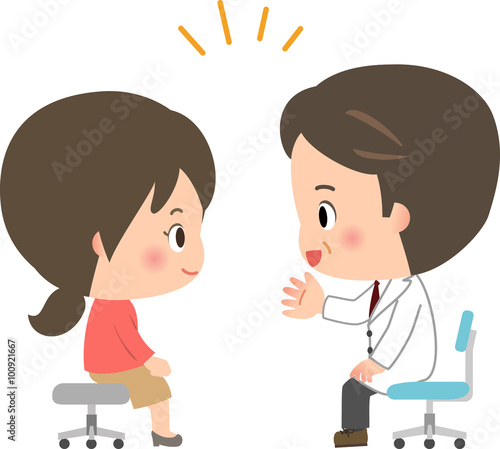 医師の説明を聞く若い女性
