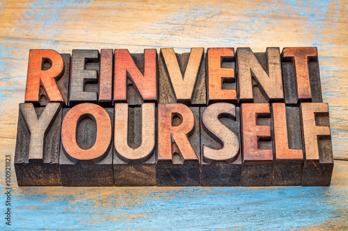 reinvent yourself - motivational words in vintage letterpress wo