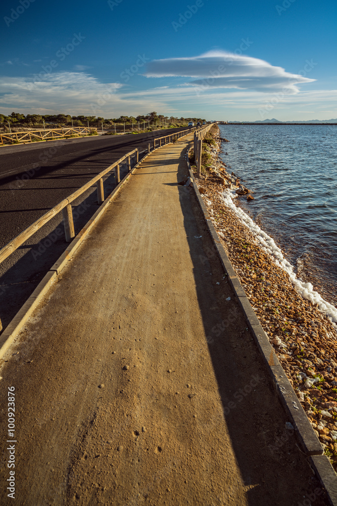 Fototapeta premium The road to the peninsula near the San Pedro del Pinatar. Region of Murcia. Spain