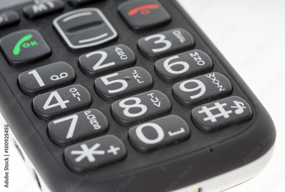 Seniors phone / Seniors phone with big buttons on a bright background Seniors phone / Seniors phone with big buttons on a bright background