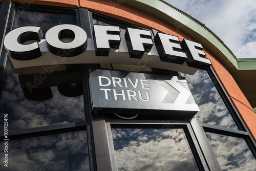 Coffee drive thru sign with reflect from glass window