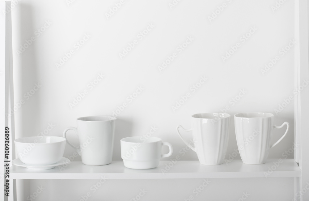 Clean dishes on wooden shelf Clean dishes on wooden shelf