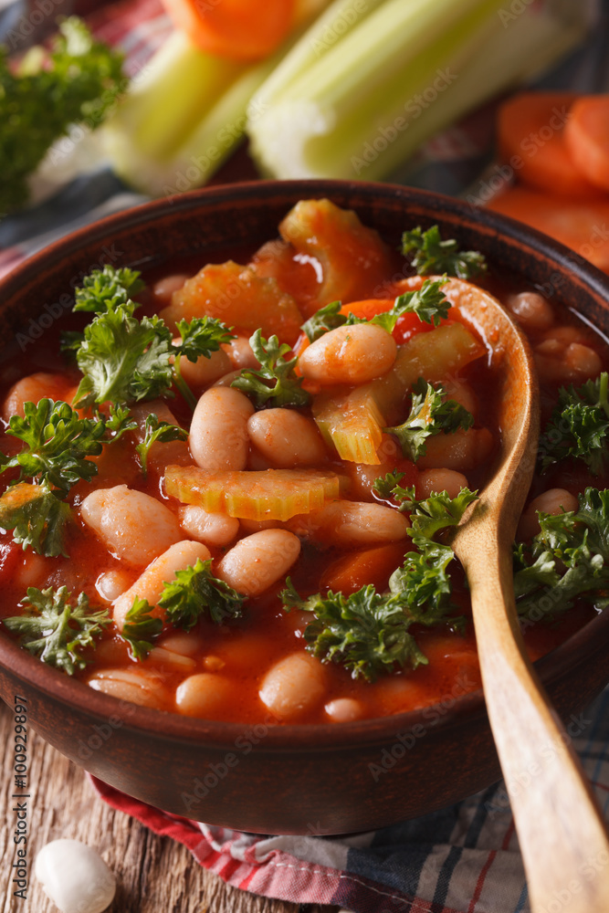Bean soup with tomatoes and celery close-up. vertical
Bean soup with tomatoes and celery close-up. vertical
