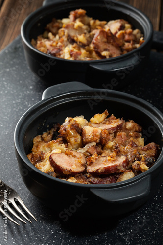 Potatoes baked with sausage and bacon