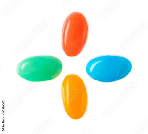 Plus symbol made of multicolored candies isolated on white