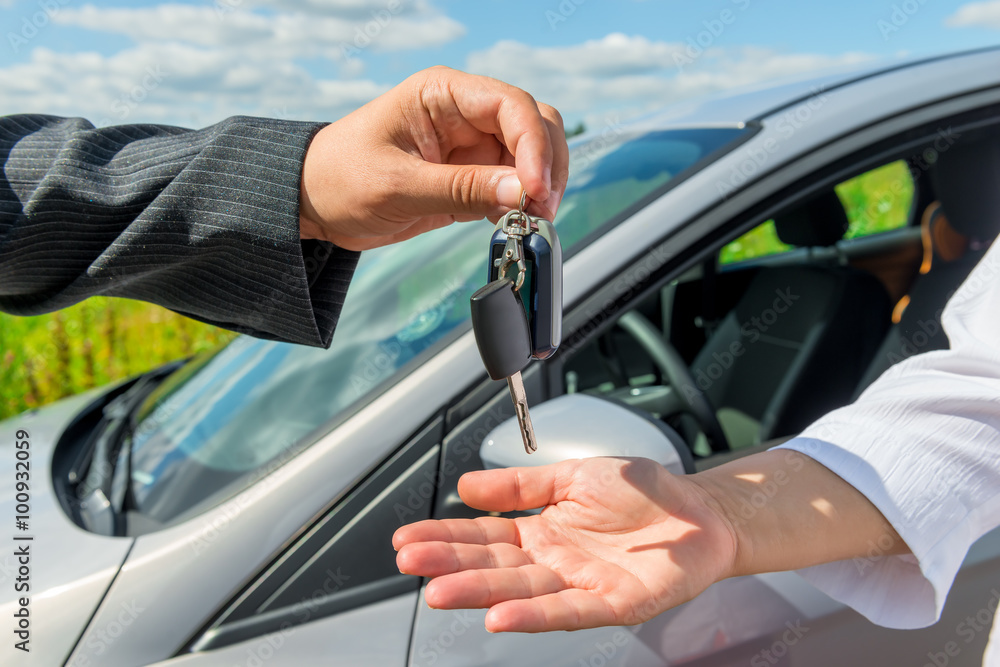 The solemn transfer the key the buyer of a new car The solemn transfer the key the buyer of a new car
