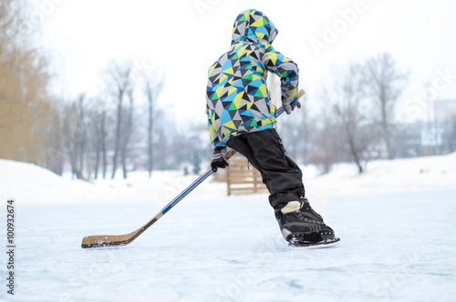 the boy plays hockey