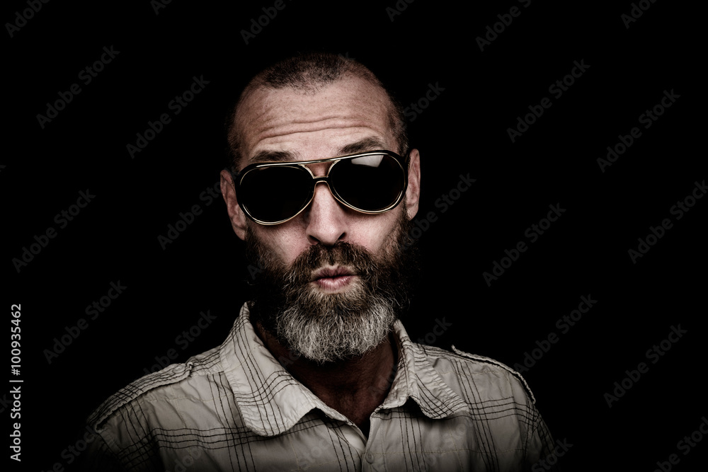 Portrait of a man with beard and sunglasses Portrait of a man with beard and sunglasses