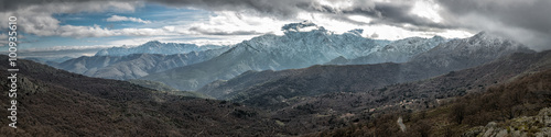 Snow capped mountains in Balagne region of Corsica photo