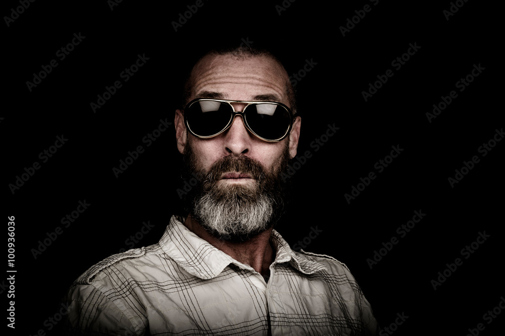 Portrait of a man with beard and sunglasses Portrait of a man with beard and sunglasses