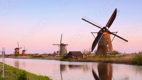 The picturesque landscape with aerial mill on the channel in Kinderdiyk, Netherlands. Full HD video (High Definition). retro style