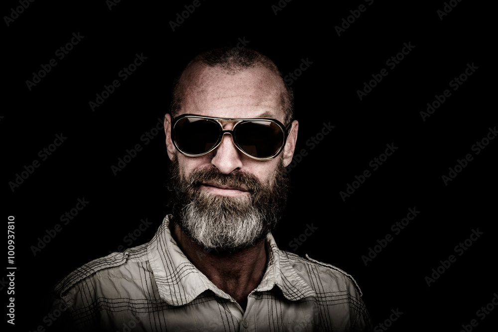 Portrait of a man with beard and sunglasses Portrait of a man with beard and sunglasses