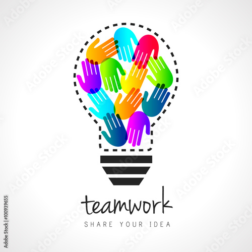 Abstract teamwork concept with lightbulb and colorful handprints inside