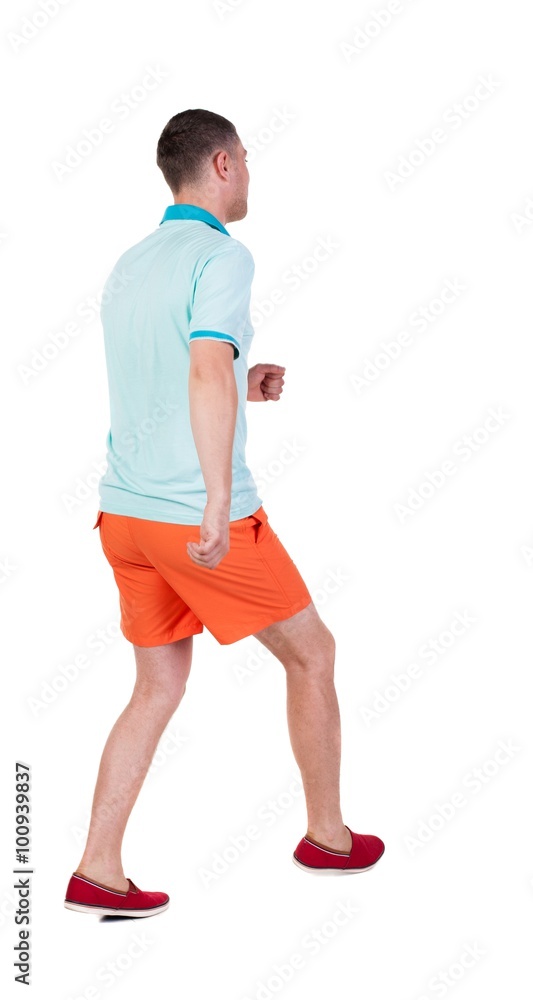 Back view of running sportsman. Back view of running sportsman.