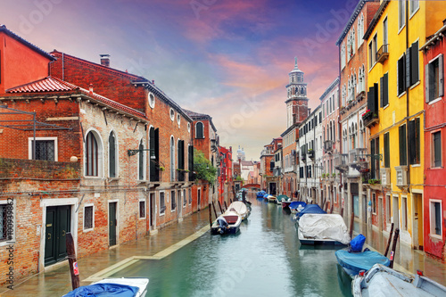 Venice landmark, canal, colorful houses and boats, Italy