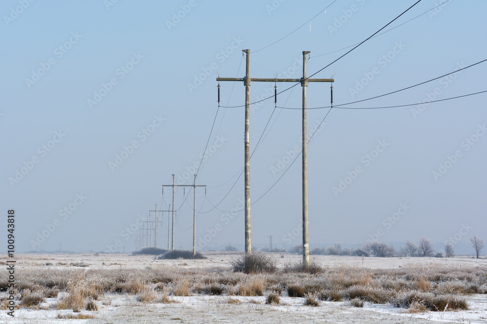 Power lines in a winter day