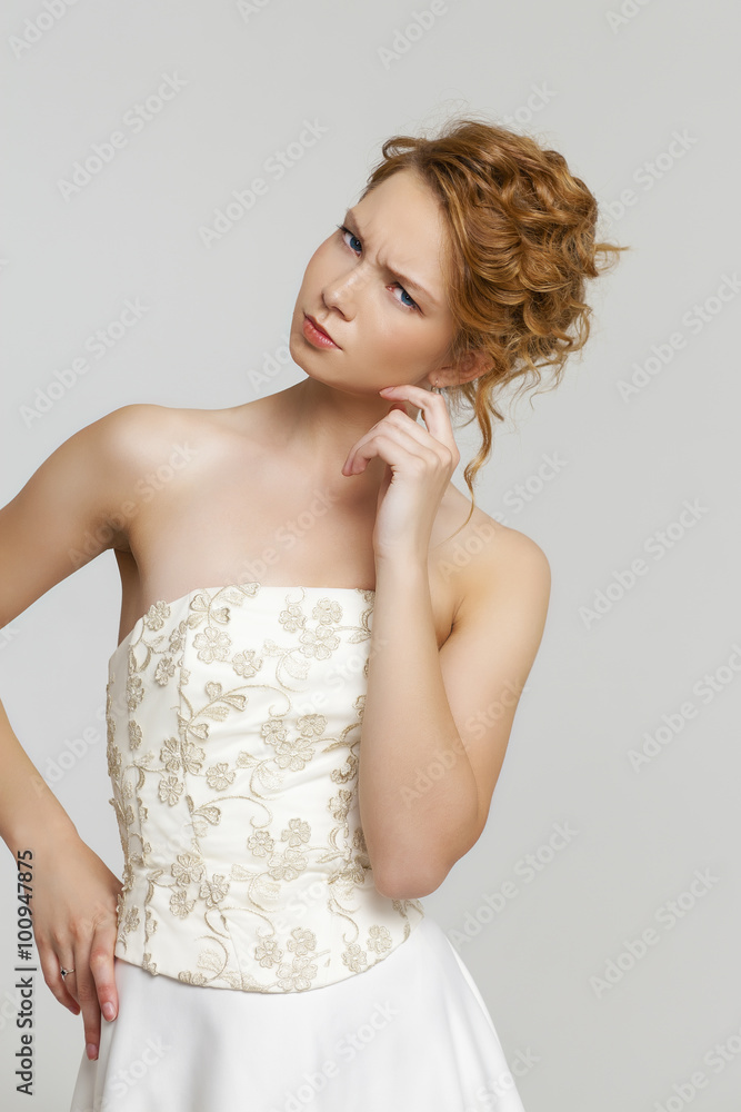 Happy beautiful young bride portrait in gray background Happy beautiful young bride portrait in gray background