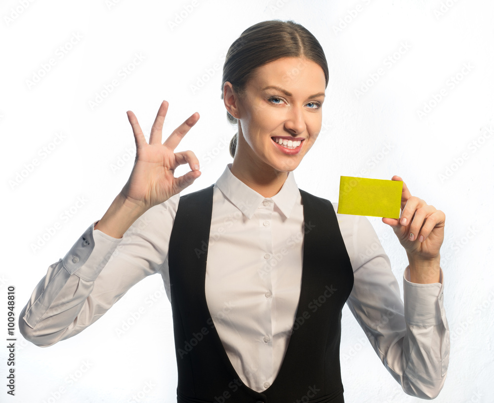Managing Director smiling showing business card yellow Managing Director smiling showing business card yellow