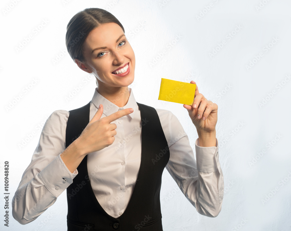 Business woman smiling showing business card yellow Business woman smiling showing business card yellow