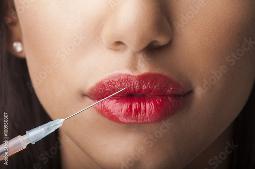 Woman with syringe photo