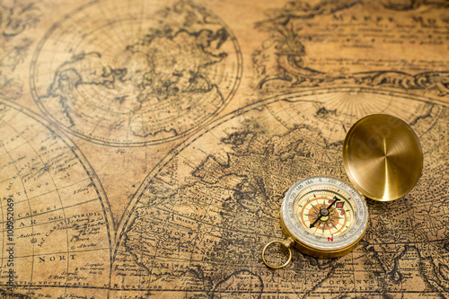 old compass on vintage map