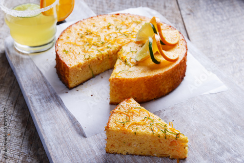 Obraz na płótnie Home made whole testy orange cake on a wooden surface