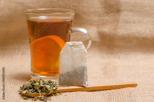 Cup of tea on wooden rustic background photo